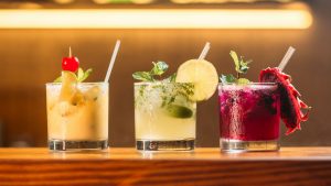 3 Cocktails on a bar.